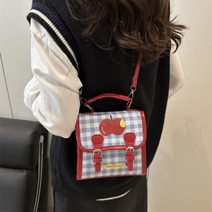 Blue and white plaid mini backpack with red leather trim and apple embroidery detail