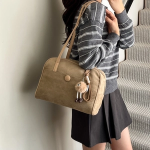 Retro camel suede shoulder bag for women with a plush pendant for winter commute fashion