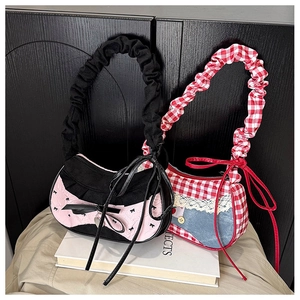 Close-up of sweet style denim patchwork and lace trim detail on women shoulder bags