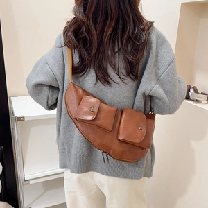 Retro brown PU leather chest bag for women with dual front pockets and adjustable strap