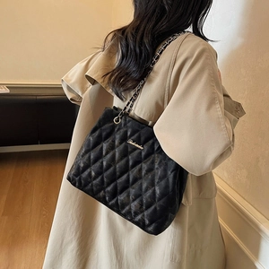 Classic black quilted shoulder bag with chain strap and matte finish for women