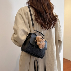Women's black crocodile pattern backpack with cute bear pendant and top handle