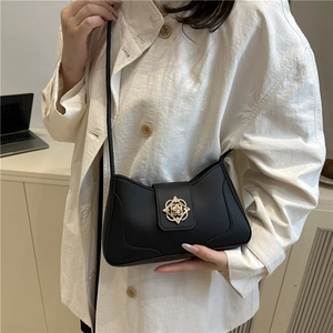 Minimalist black faux leather shoulder bag with vintage gold floral buckle for women