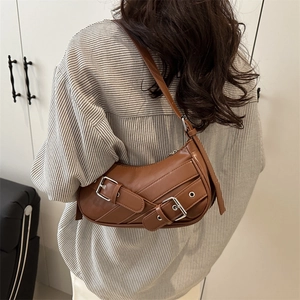 Brown faux leather hobo underarm bag with silver buckles and adjustable strap for women