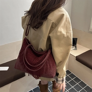 Burgundy oversized tote bag with bohemian tassels and leopard print details for women