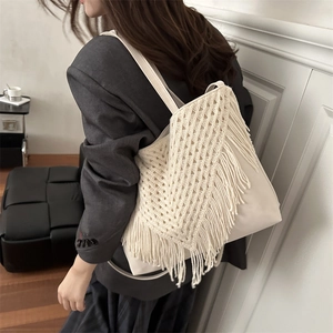 Bohemian white knit tassel tote bag with crochet fringe detail and leather base