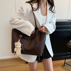 Large dark brown leather tote bag for women with shoulder straps and cute bear charm