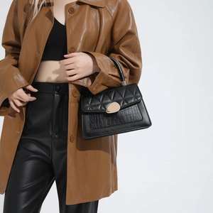 Fashionable black handbag featuring quilted pattern and crocodile leather texture for women