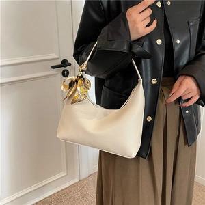 Chic beige lychee leather hobo bag with printed silk scarf wrap on shoulder handle