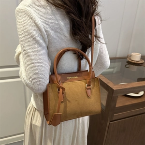 Minimalist brown crossbody bag for women with top handle and faux suede texture