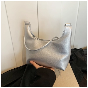 Close-up of silver PU leather crescent bag featuring detailed lychee grain texture