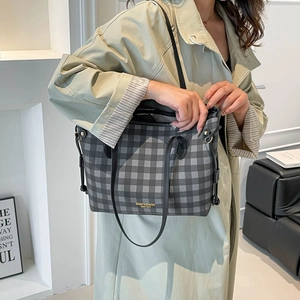 Classic checkered tote bag with top handles and adjustable shoulder strap in grey tones