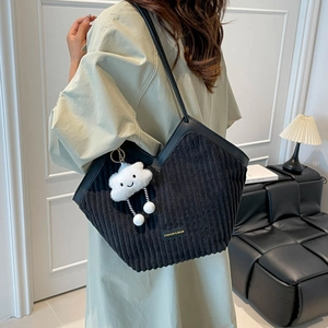 Black corduroy tote bag with leather straps and a cute white cloud plush pendant