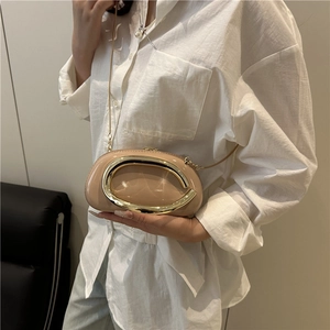 Chic beige pillow bag with gold curved metal handle and thin chain strap for women