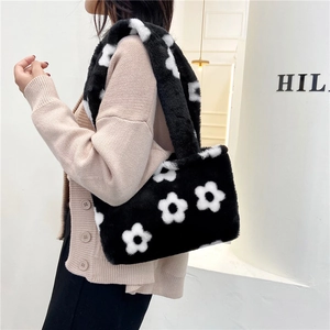 Plush tote bag with black and white daisy floral pattern and matching soft shoulder strap