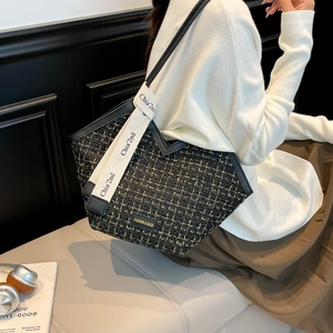 Chic tweed tote bag with yellow plaid patterns and leather straps for winter fashion