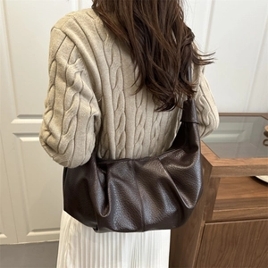 Retro dark brown pleated dumpling bag worn with casual knitwear and pleated skirt
