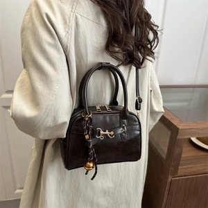 Vintage dark brown oil wax leather Boston bag with gold zippers and tassel detail