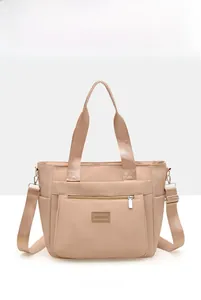 Detailed front view of high-density nylon tote bag with zipper pocket and dual handles