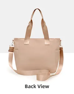 Detailed back view of a beige nylon tote bag showing the multi-pocket design and strap