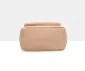 Detailed base view of the beige nylon tote bag showing rectangular structure and stitching