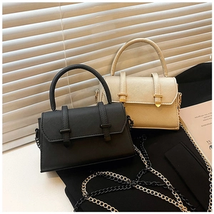 Detail of mini flap crossbody bags with cross-grain texture and metal chain strap