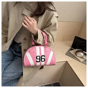 Retro pink striped bowling handbag with 96 print shown in a casual lifestyle setting