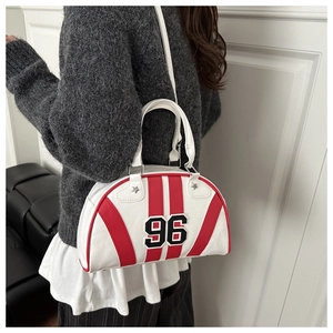Close-up of vintage style white leather bowling bag with red stripes and number 96