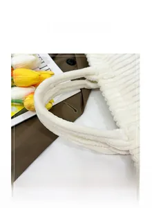 Detail view of thickened soft white corduroy handles on a large capacity tote bag
