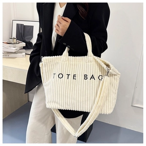 Off-white corduroy tote bag with TOTE BAG embroidery and adjustable shoulder strap