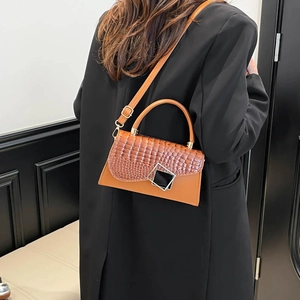 Chic tan square crossbody bag with crocodile embossed flap and round top handle for women