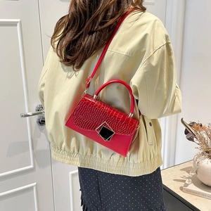Elegant red crocodile texture crossbody bag with gold buckle and top handle for women