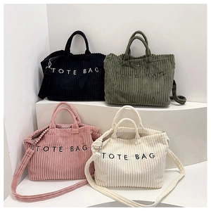 Collection of corduroy tote bags in black, green, pink, and beige with embroidery