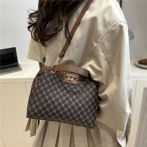 Retro dark brown crossbody handbag with vintage metal clasp and top handle for women