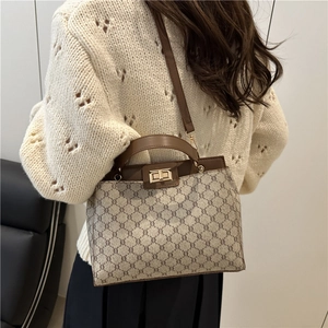 Vintage patterned handbag with leather trim and gold twist-lock for women