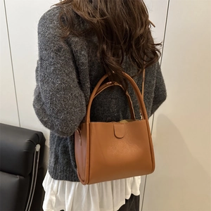 Retro brown leather bucket bag for women, stylish crossbody tote for daily commuting