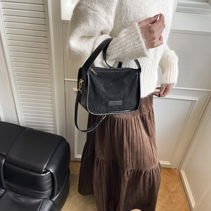 Retro black suede and leather patchwork shoulder bag with elegant gold hardware for women