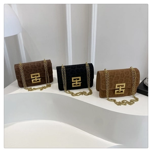 Detailed view of three leopard print chain bags in coffee, black and light brown colors