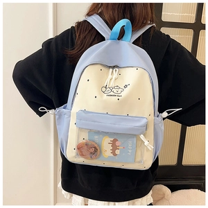 Detail of light blue school backpack with a transparent window for pins and anime cards