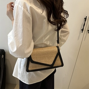 Chic woven beige crossbody bag with black trim and V-shaped flap for women