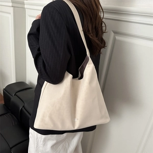 Minimalist cream white leather tote bag for women showing spacious business style