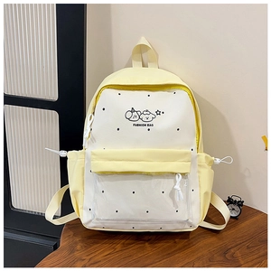 Detail of polka dot student backpack with cartoon character and transparent front pocket