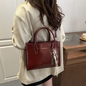 Fashion dark red glossy tote bag with handles and adjustable strap for women