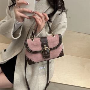 Retro pink suede matte handbag with brown leather trim and golden horseshoe metal buckle