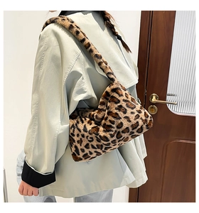 Detail shot of a plush leopard print shoulder bag showcasing its soft faux fur texture