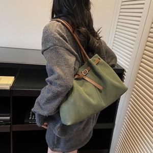 Olive green large capacity tote bag with brown leather straps and matte finish