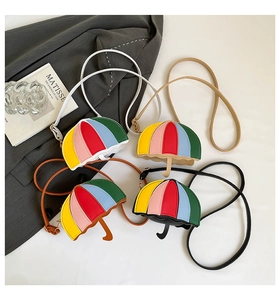Detail of umbrella-shaped mini crossbody bags with rainbow stripes in four stylish colors