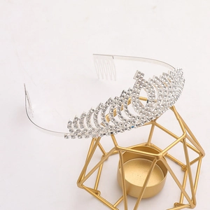 Detail of bridal crown showing intricate rhinestone inlay on silver alloy band with combs