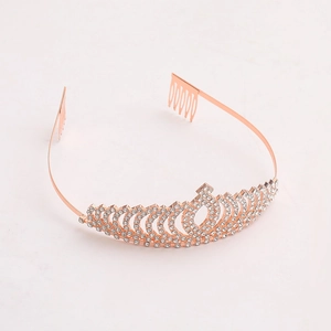 Detail of rose gold bridal tiara with sparkling rhinestones and securing hair combs