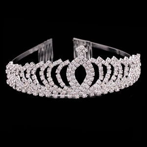 Close-up of silver bridal crown featuring shimmering rhinestones and secure hair combs